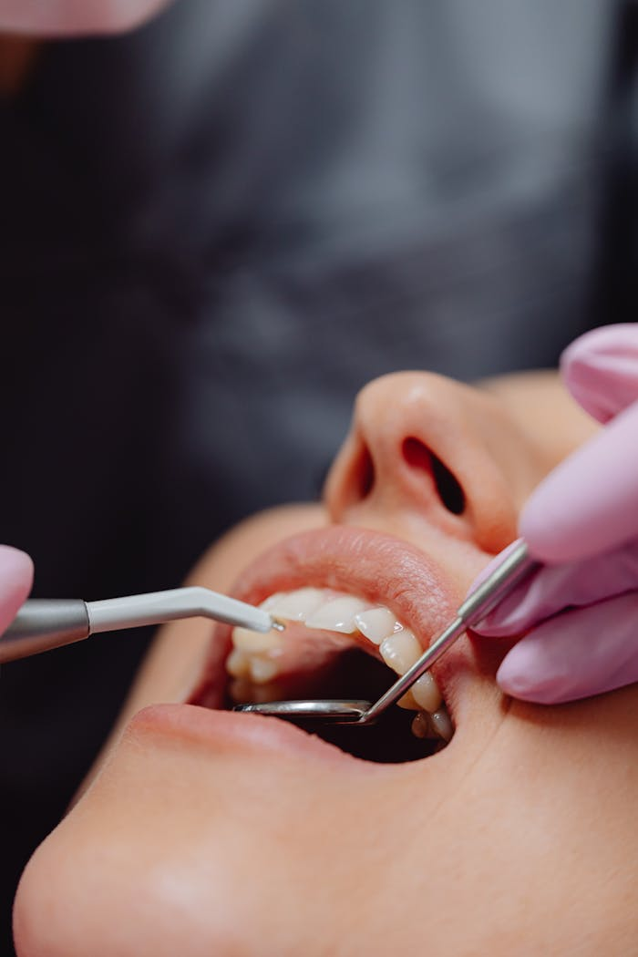 about-01 Close-up of dental procedure highlighting hygiene and patient care.